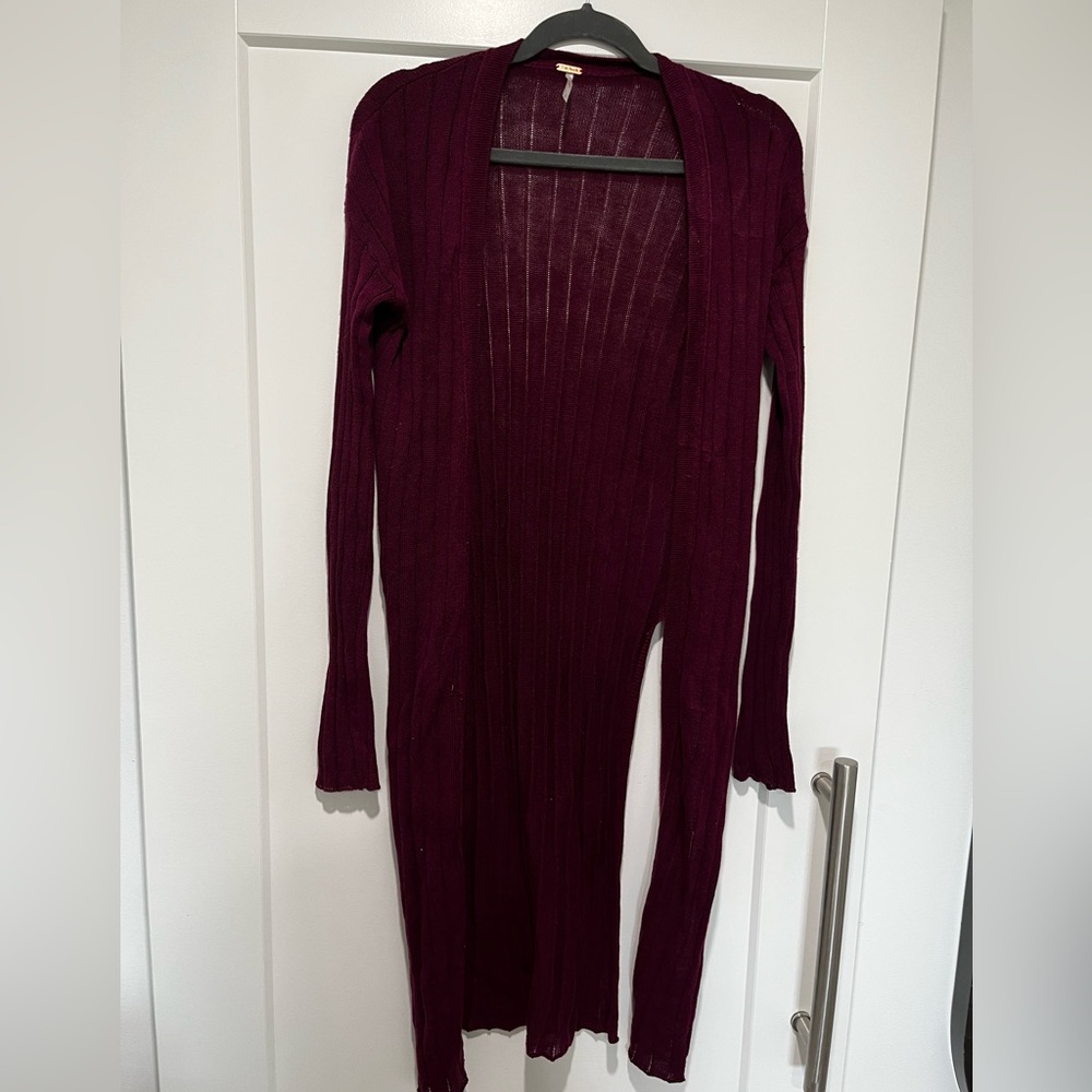 Egg plant/wine coloured cardigan with side slits.
